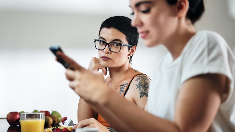 Woman looking suspiciously at partner