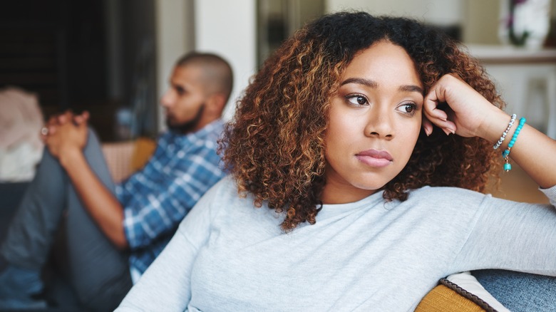 Unhappy couple on couch