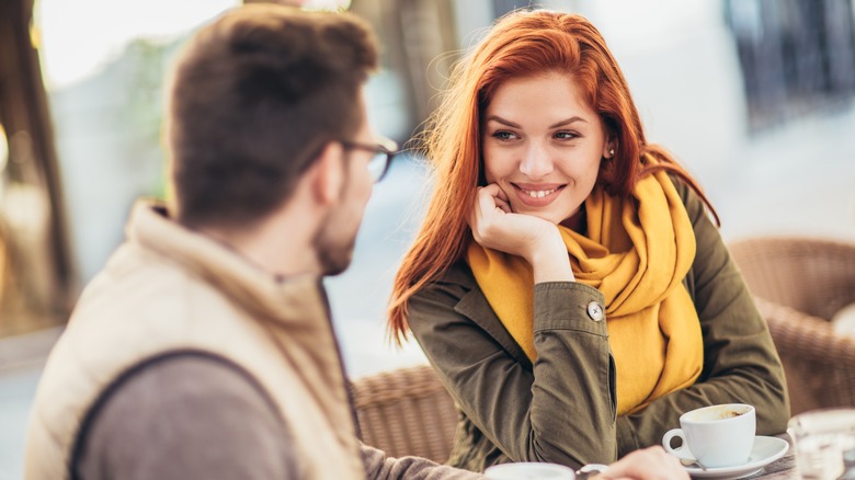 Charming woman looking at man