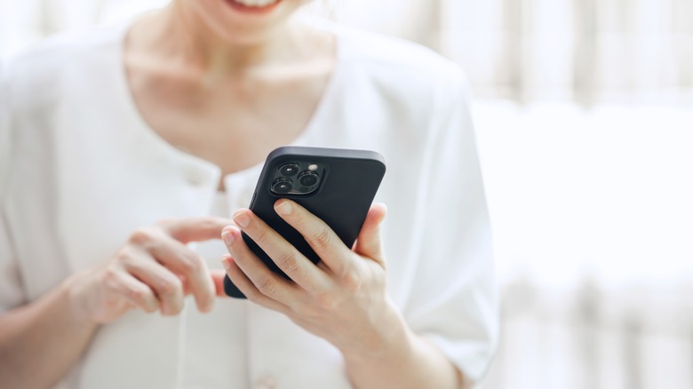 close-up of a woman on her phone