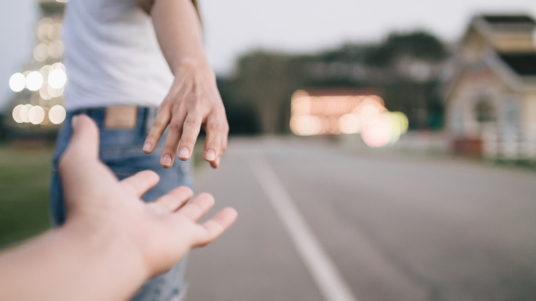 couple about to hold hands