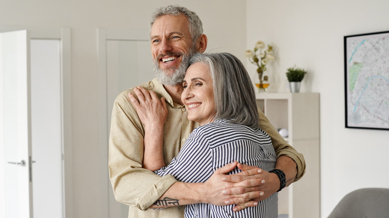 happy man and woman hugging