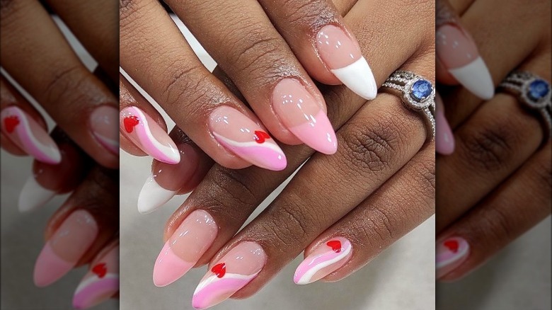 pink and red heart swirl manicure