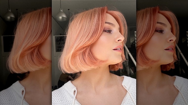 woman with short peach hair color