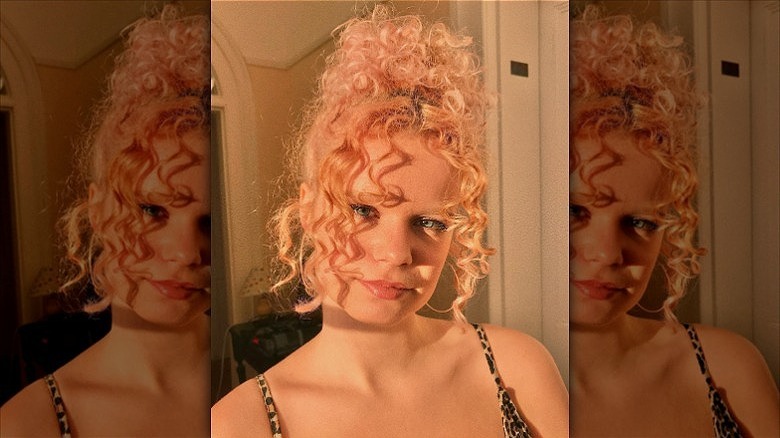 woman with peach curly hair