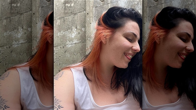 woman with peach underside hair dye