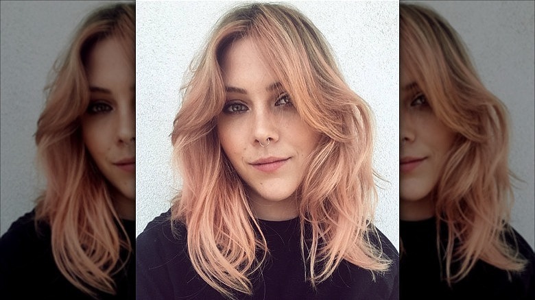 woman with peachy pink shag hair