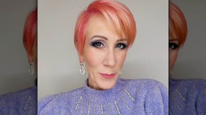 woman with peach pixie cut