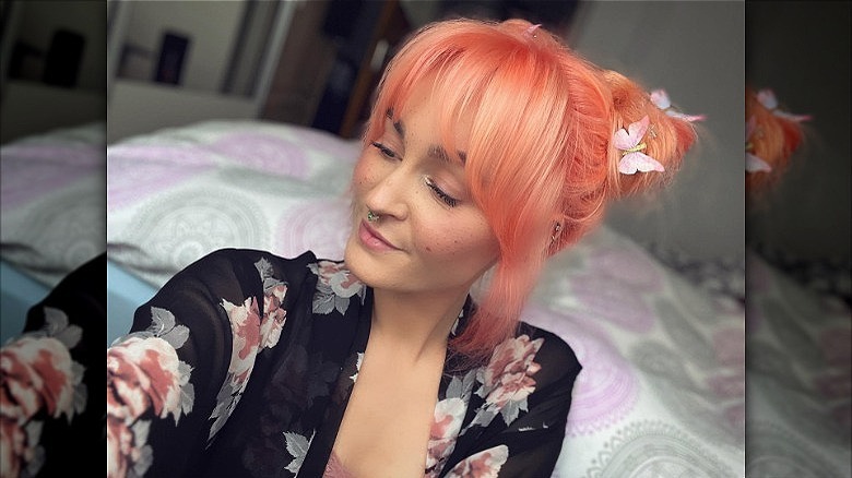 woman with peach space buns