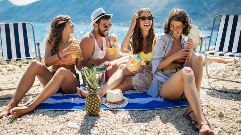 Friends sitting together laughing 