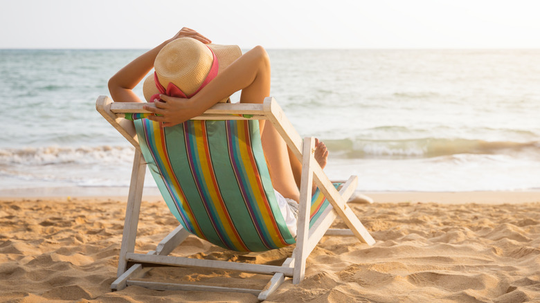 woman lounging on beach