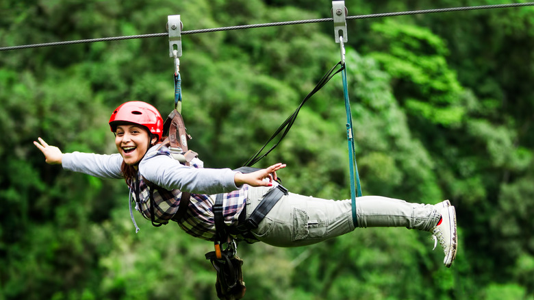 Woman posing on zip line 