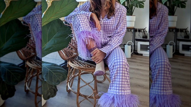 Girl wearing feather-trimmed pajama set