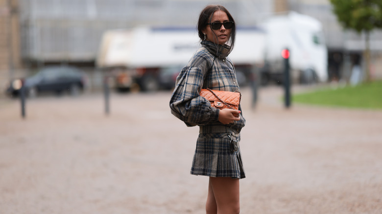 woman wearing plaid outfit