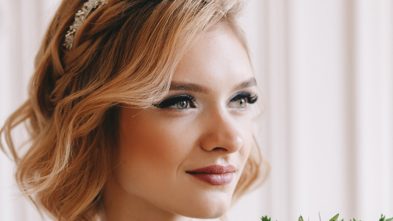 Woman with short blond curls