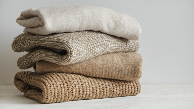 Beige cashmere sweaters stacked