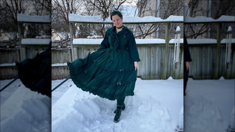 woman wearing green dress in snow