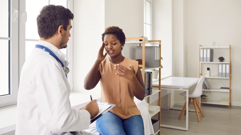 woman speaking to doctor