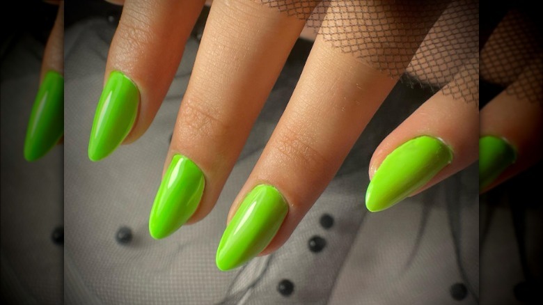 woman with lime green nails