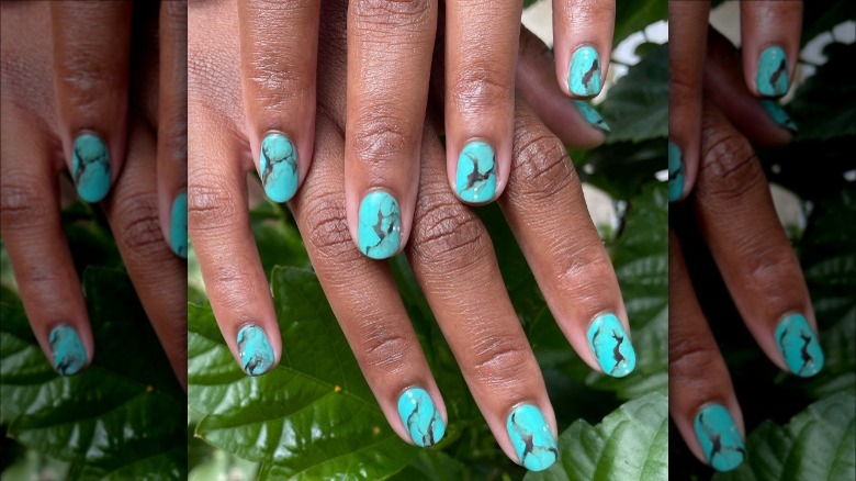 woman with turquoise nails