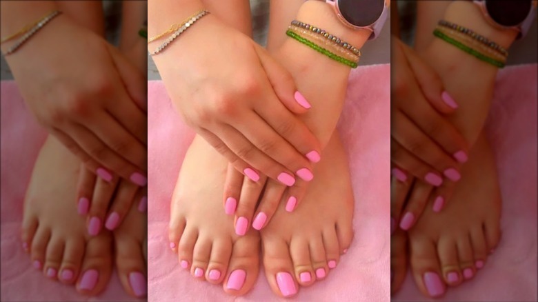 woman with barbie pink nails