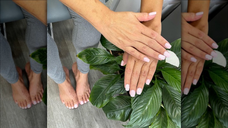 woman with pale pink nails