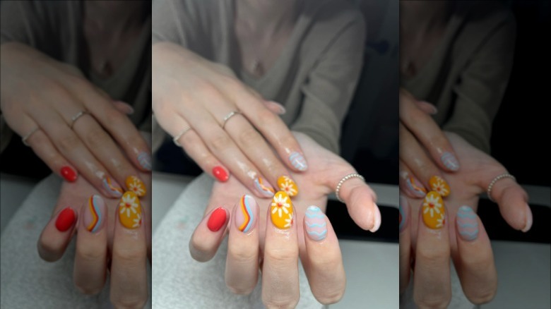 woman with primary color nails