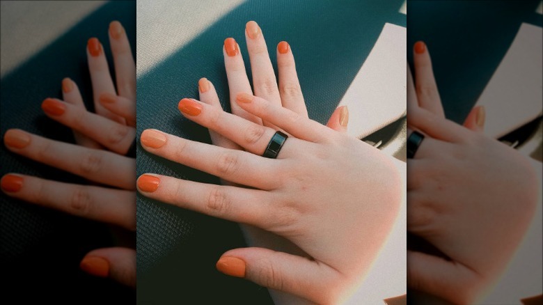 woman with retro orange nails