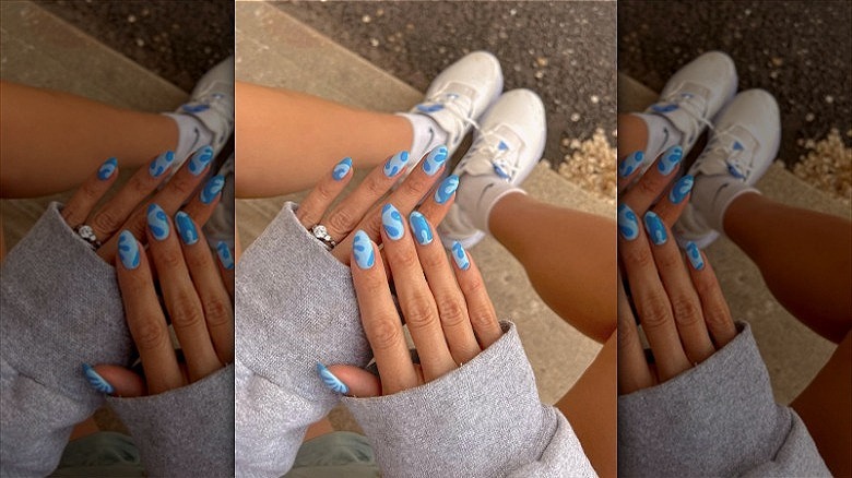 woman with ocean blue nails