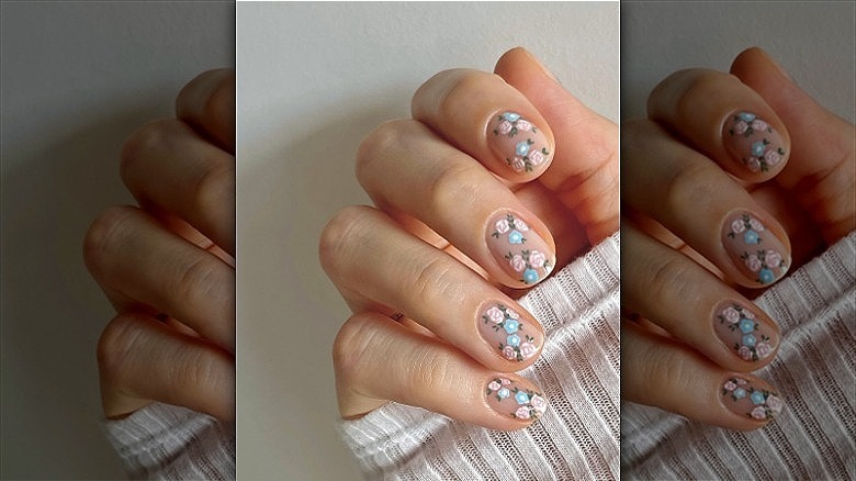 woman with floral manicure design