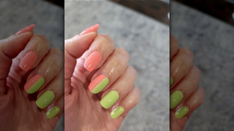 woman with pink and green nails