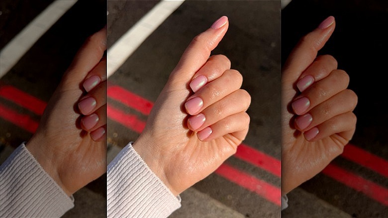 woman with pink nails