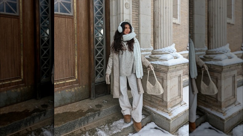 Woman wearing Uggs, a scarf, gloves, and earmuffs