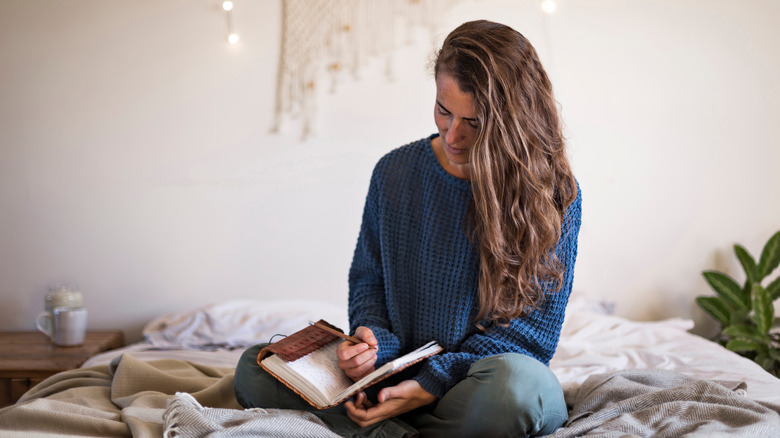 woman writing in journal