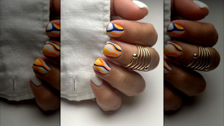 Orange, blue and white nail art