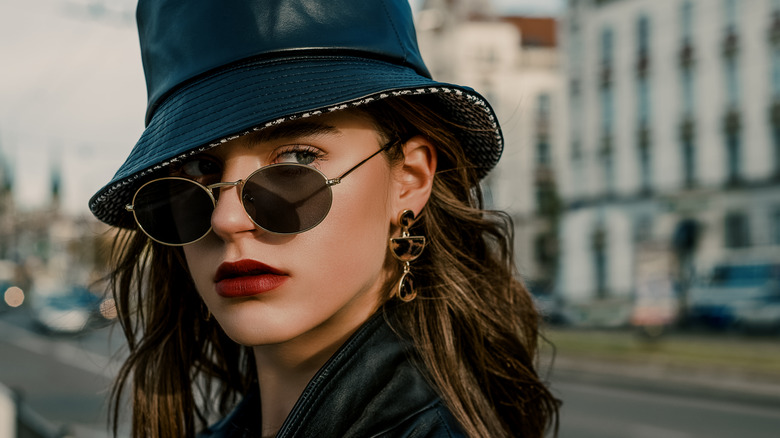 woman wearing thin oval sunglasses