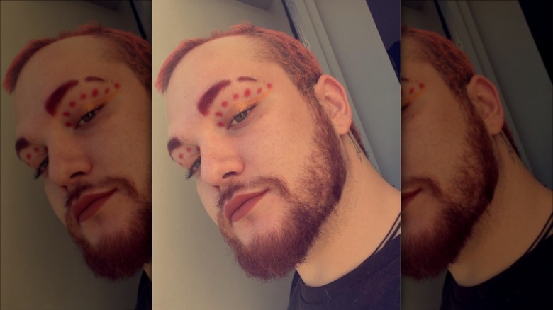 man wearing dots graphic eyeliner
