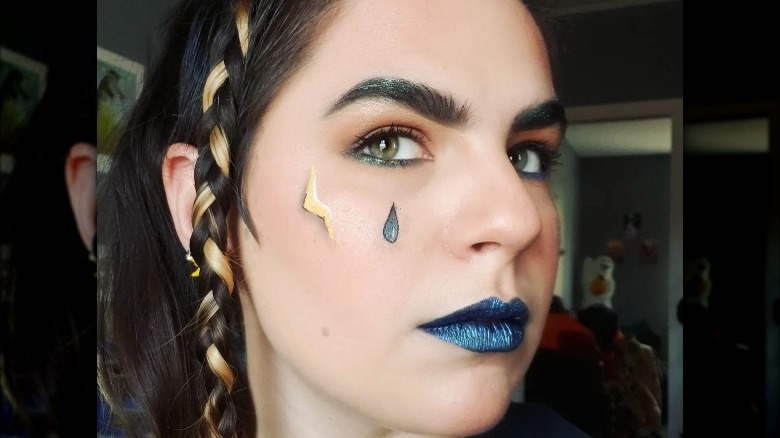 woman wearing teardrop graphic eyeliner