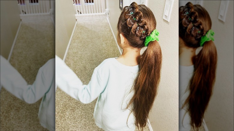 girl wearing green scrunchie braided ponytail