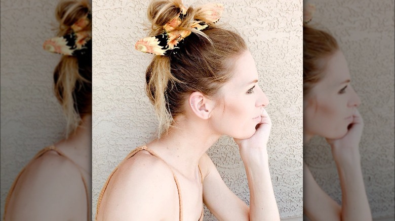 woman wearing bow scrunchie around bun