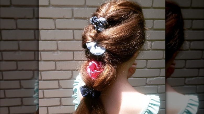 woman wearing twisted scrunchies ponytail