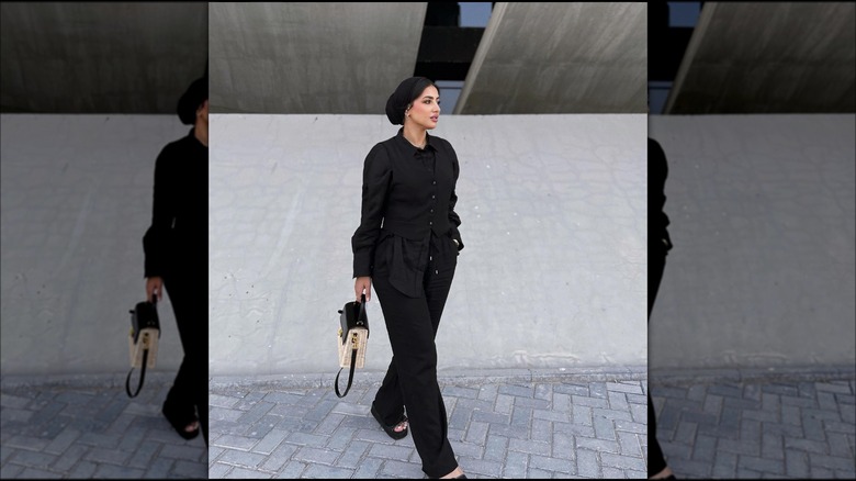 woman in black waistcoat 