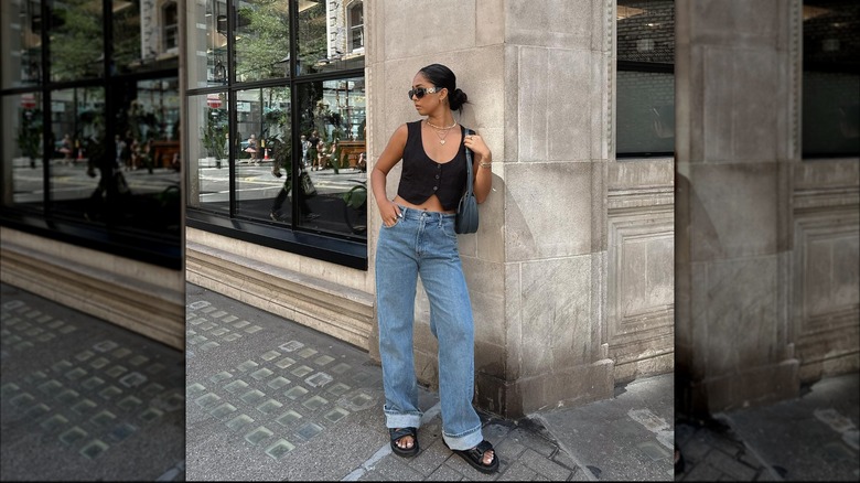 woman in waistcoat and jeans outfit