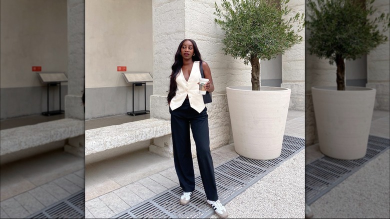 woman in waistcoat and black trousers