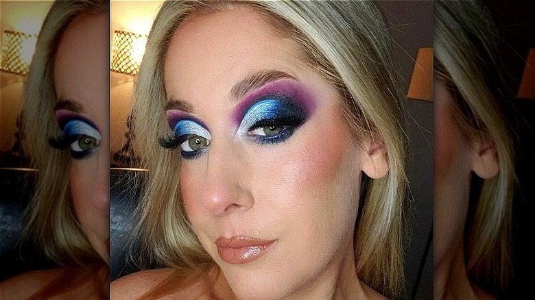 A woman with colorful eye makeup