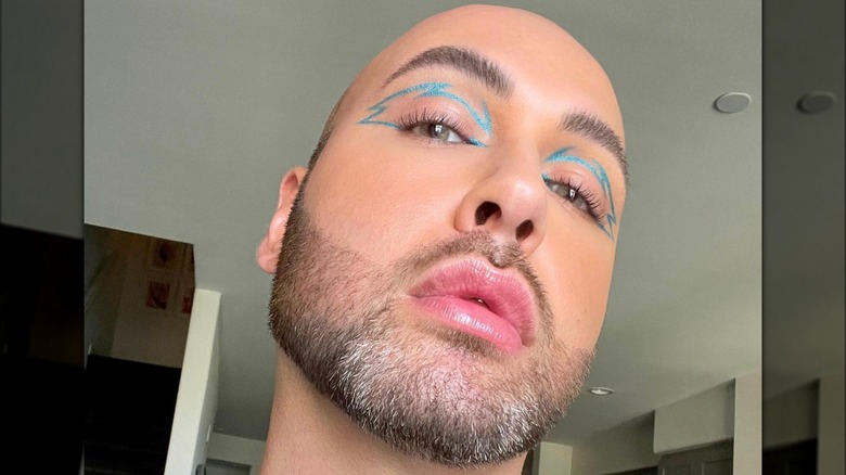 A man with blue graphic liner