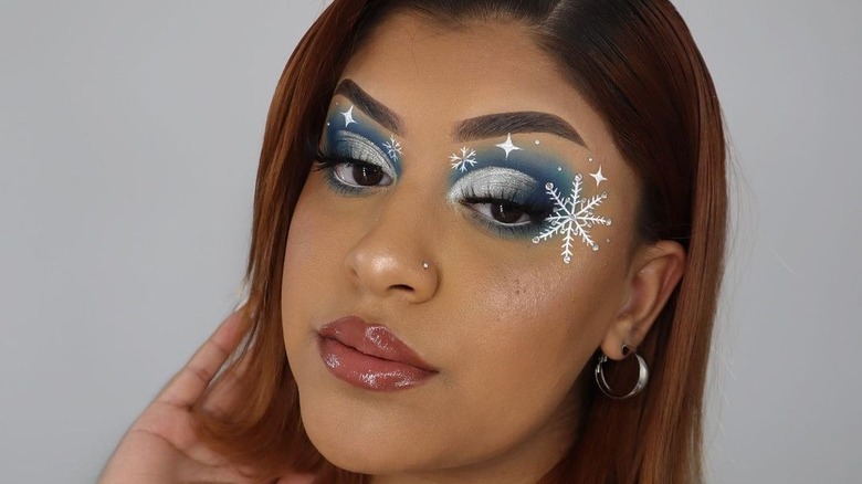 A woman with snowflake makeup