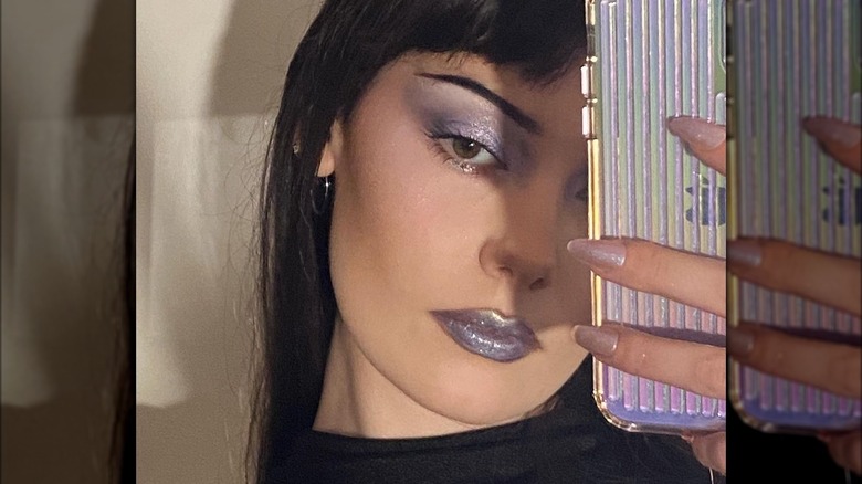 A woman with metallic makeup