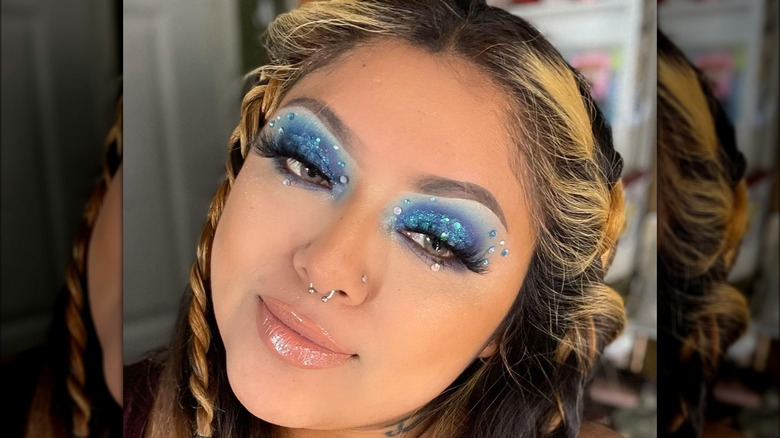 A woman with blue eye makeup