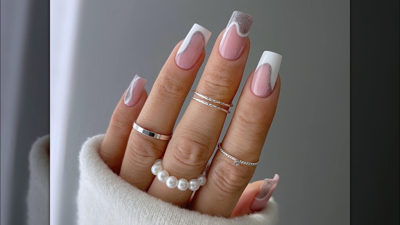 hand with gray white french manicure